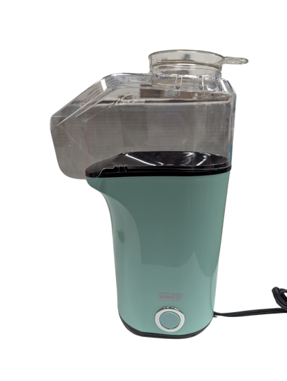 Green and clear plastic appliance on a white background