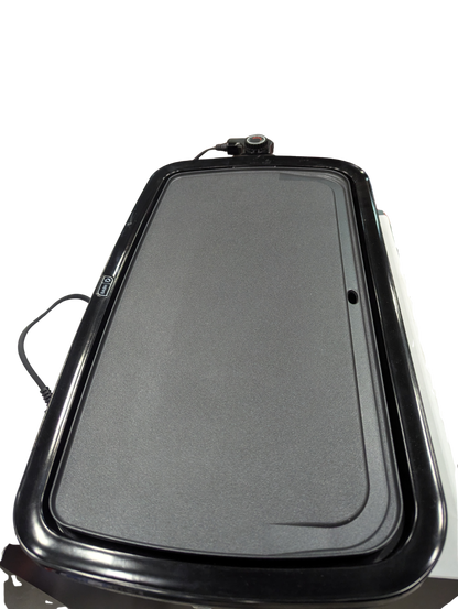 Black rectangular griddle on a white background