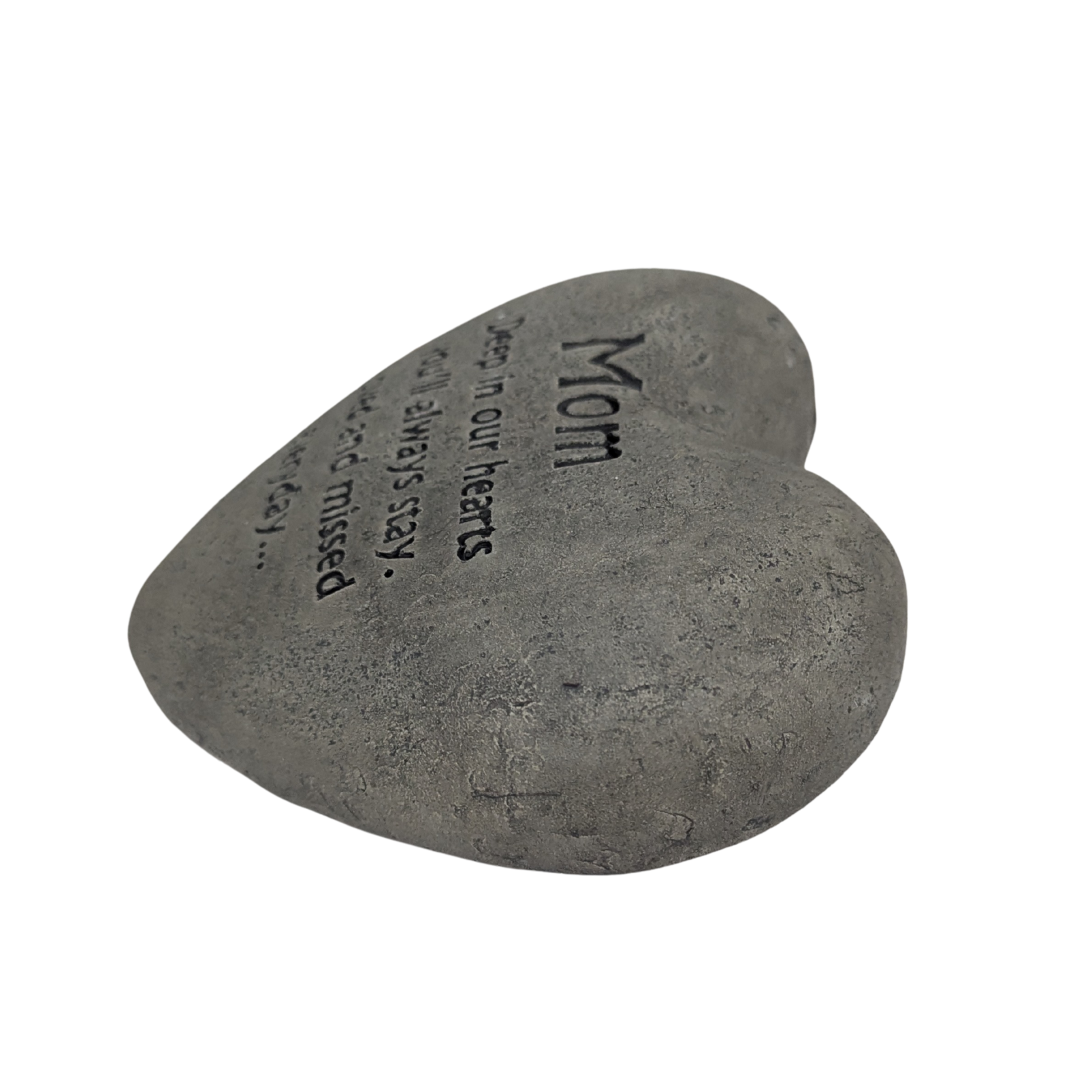 Heart-shaped stone with engraved text on a white background
