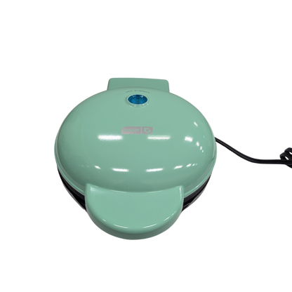 Mint green waffle maker on a white background