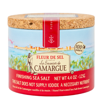 Fleur de Sel sea salt container with cork lid on a white background