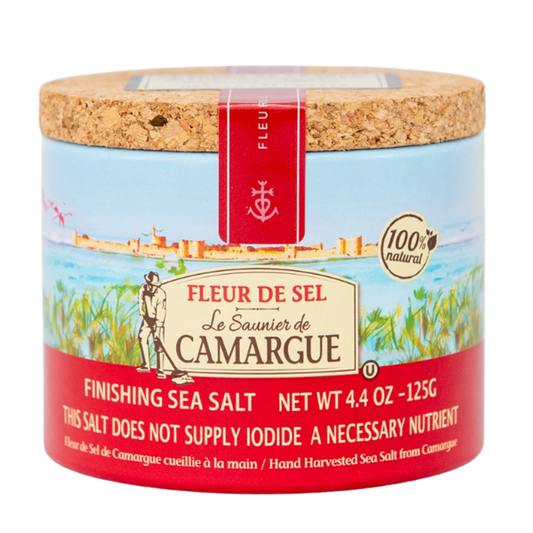 Fleur de Sel sea salt container with cork lid on a white background