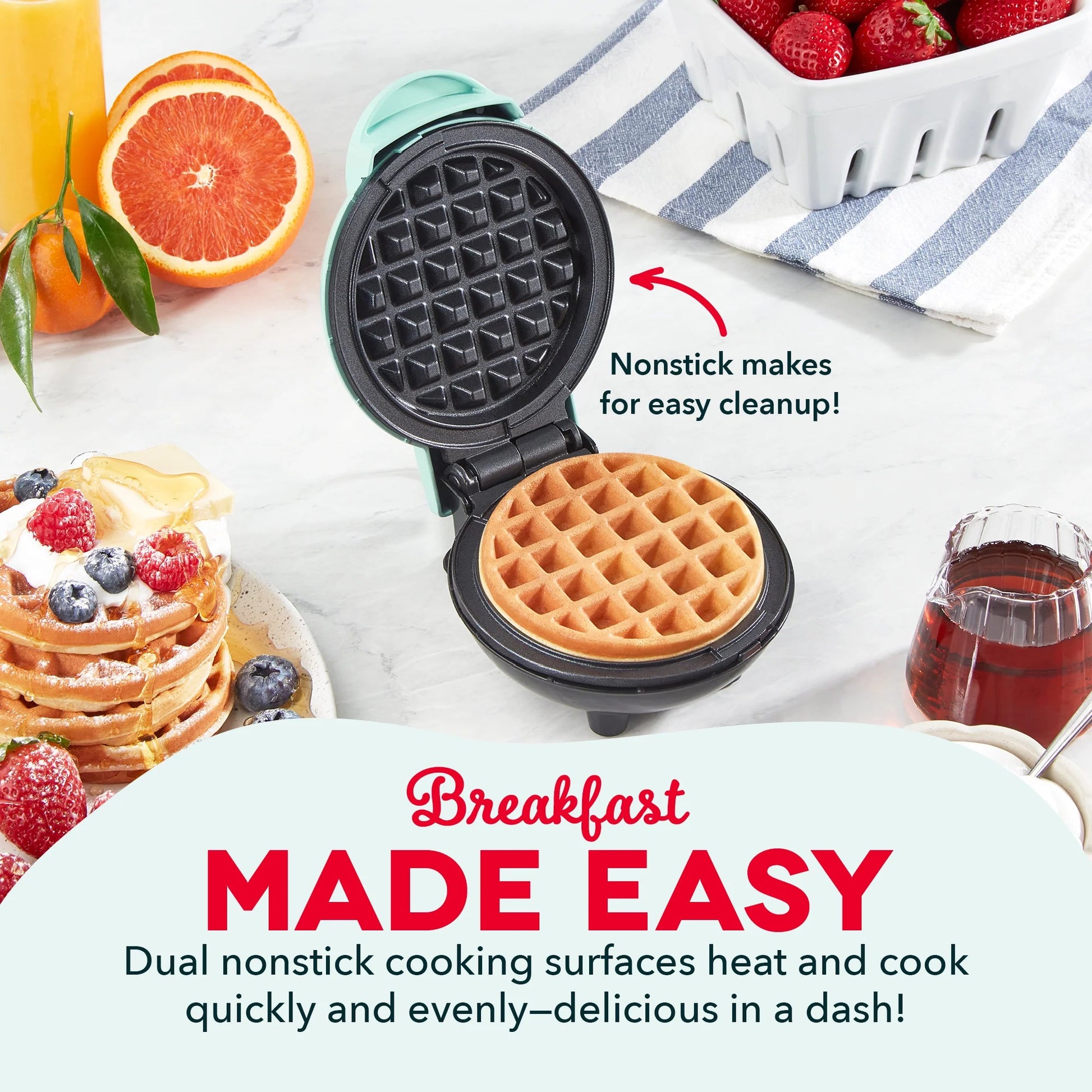 Waffle maker with a cooked waffle, surrounded by breakfast items like fruit and juice.