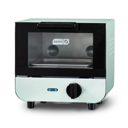 Mint green toaster oven with black interior on a white background